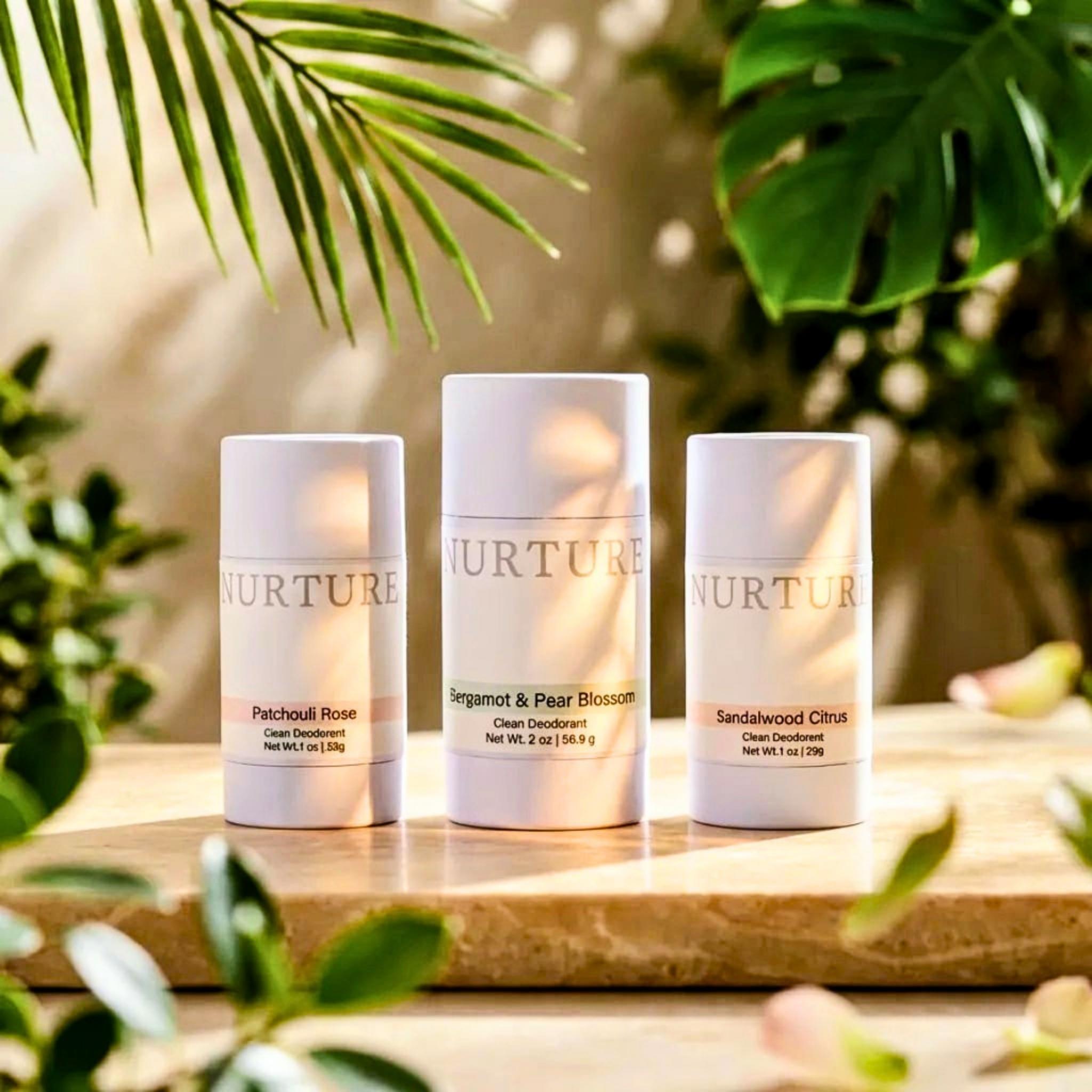 3 Nurture Clean Deodorants on a stone surface.