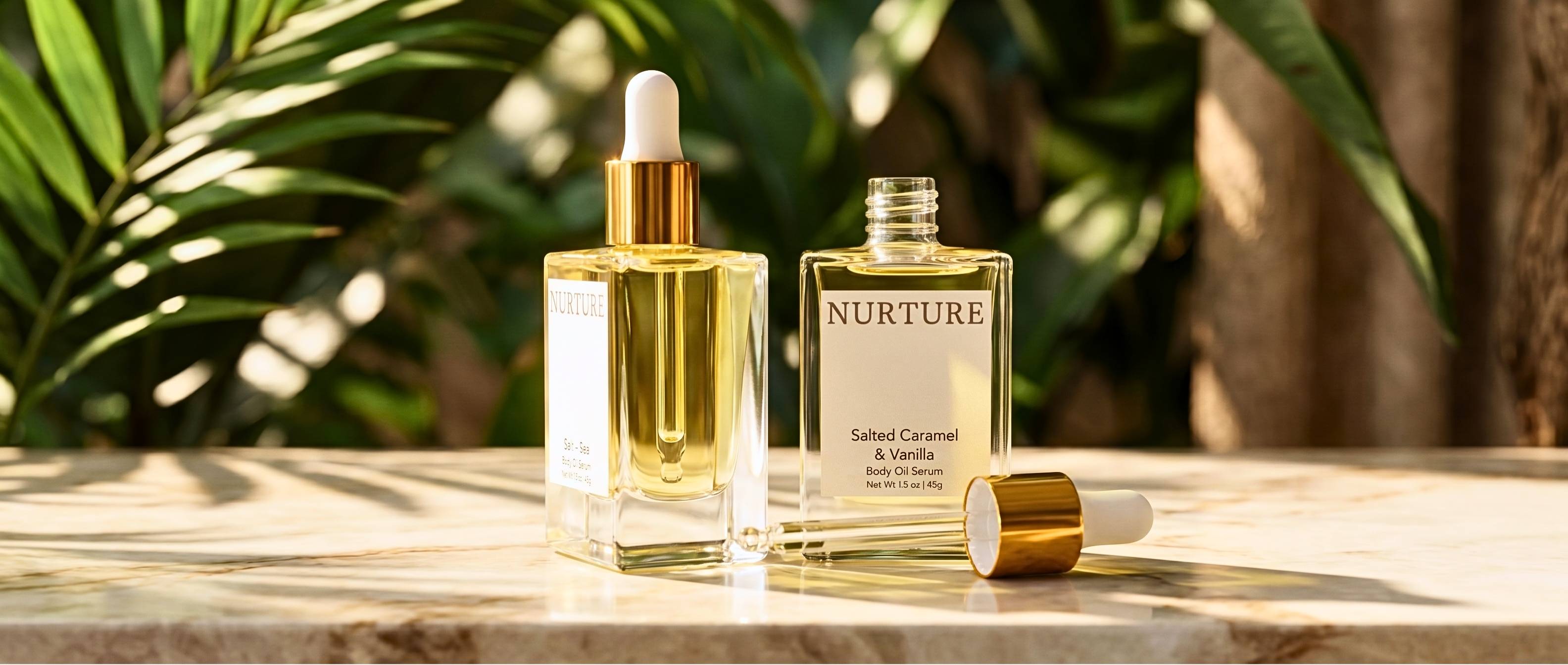 2 Nurture Body Co body oils on a stone surface