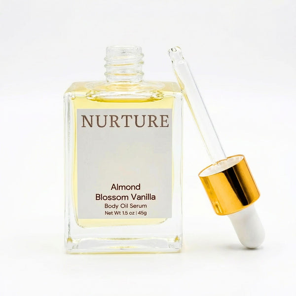 Nurture Almond Blossom Vanilla body oil serum with dropper on a white background