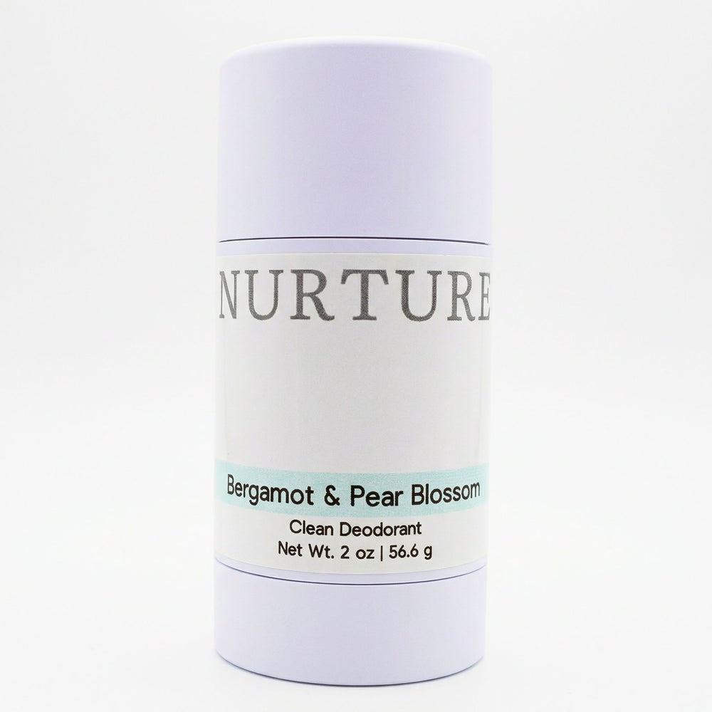 Deodorant stick labeled 'Nurture' with Bergamot & Pear Blossom scent on a white background