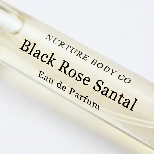 Black Rose Santal atomizer closeup on a white background.