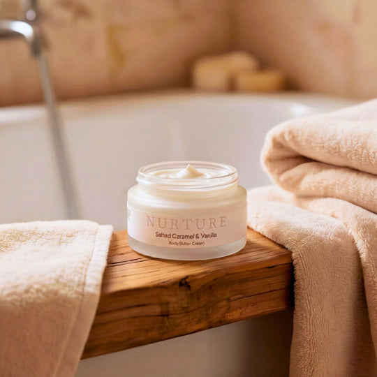 Jar of body butter on a wooden ledge.