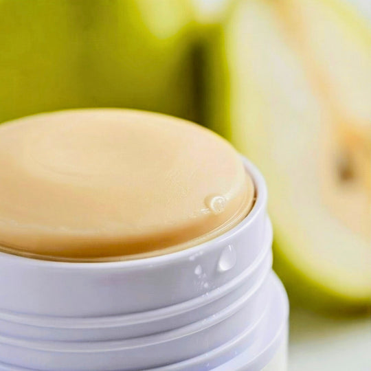 Bergamot + Pear Blossom deodorant close-up with the cap off.