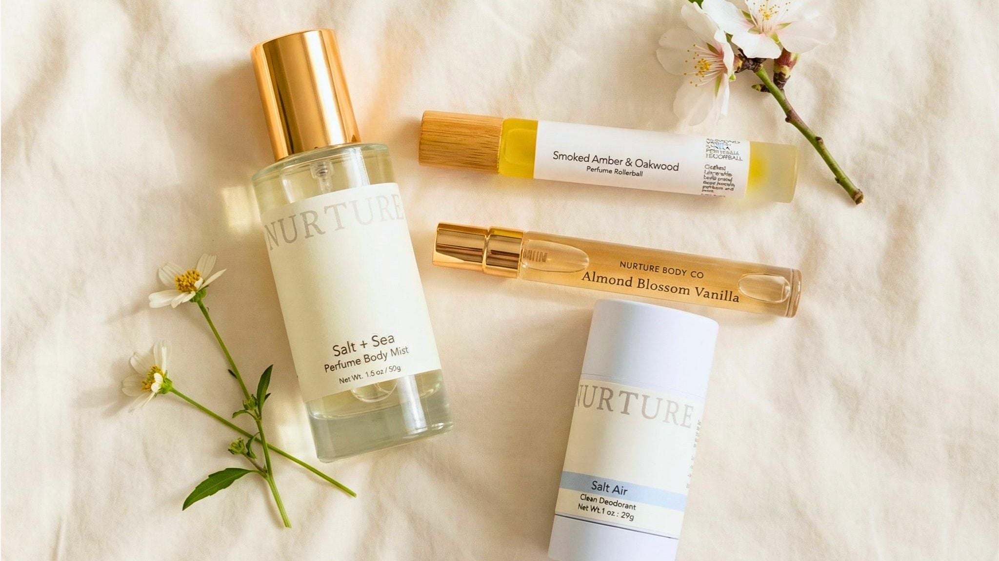 Nurture skincare products on a soft fabric background with flowers.