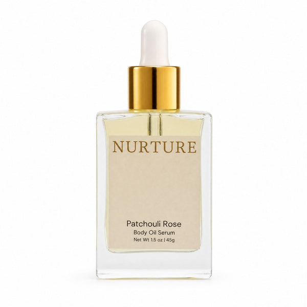 Bottle of Patchouli Rose body oil on a white background.