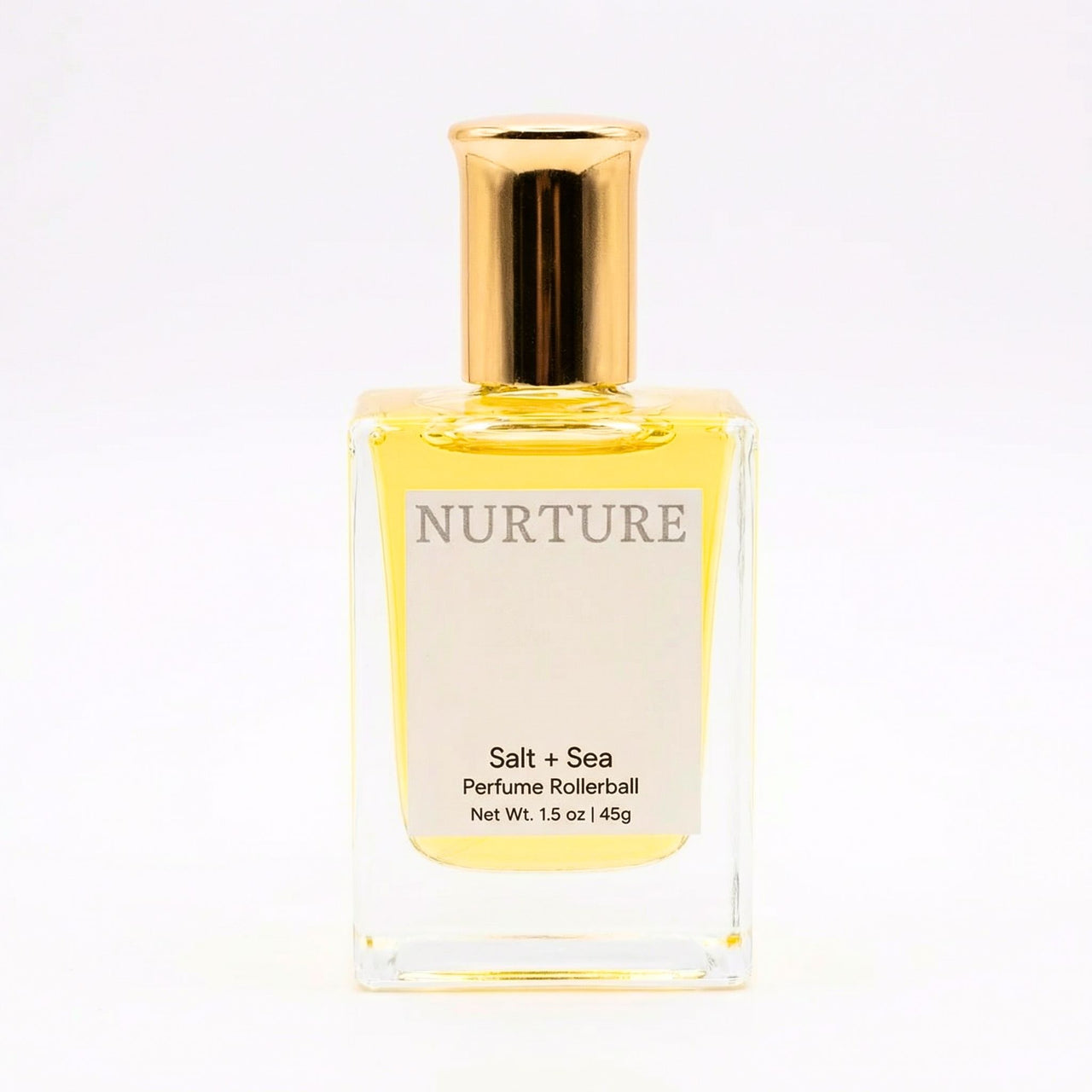 Perfume rollerball labeled 'Nurture Salt + Sea' on a white background