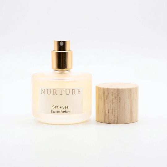 Bottle of Salt + Sea perfume on a white background.