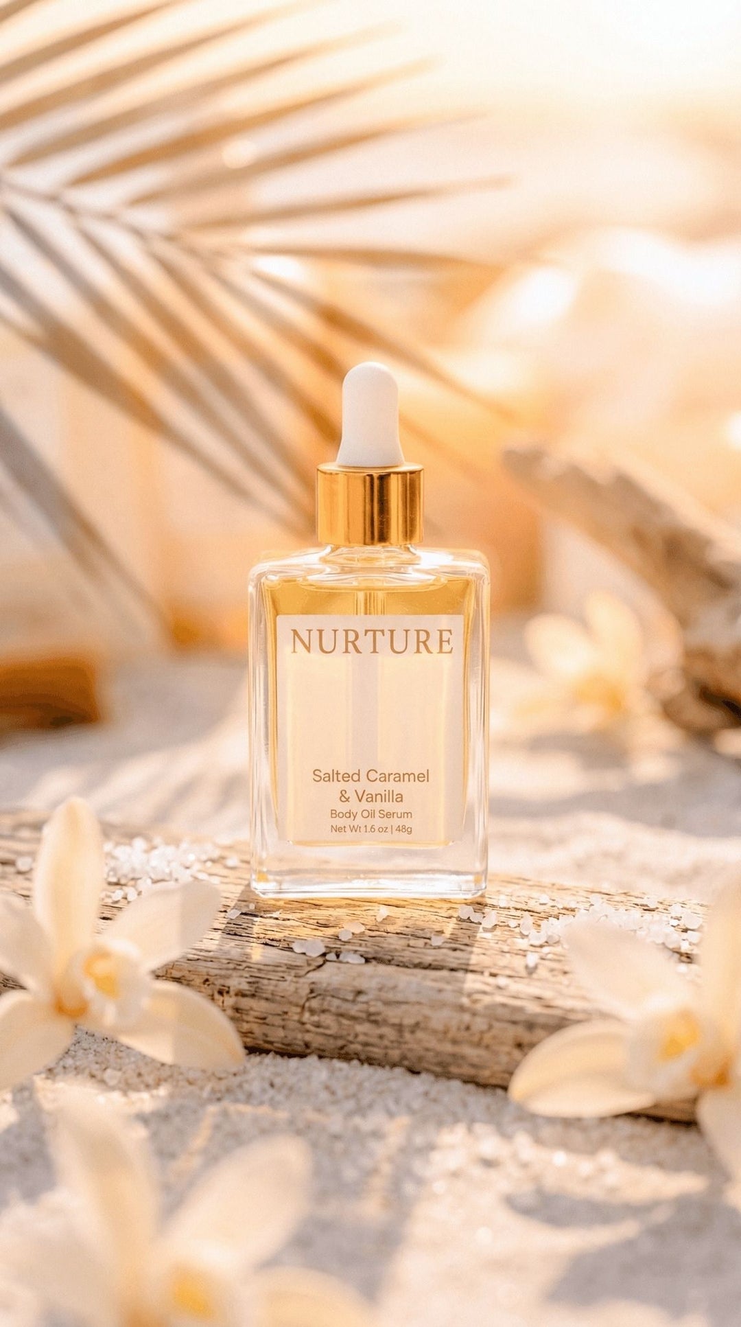 Nurture Salted Caramel & Vanilla body oil on a piece of driftwood.
