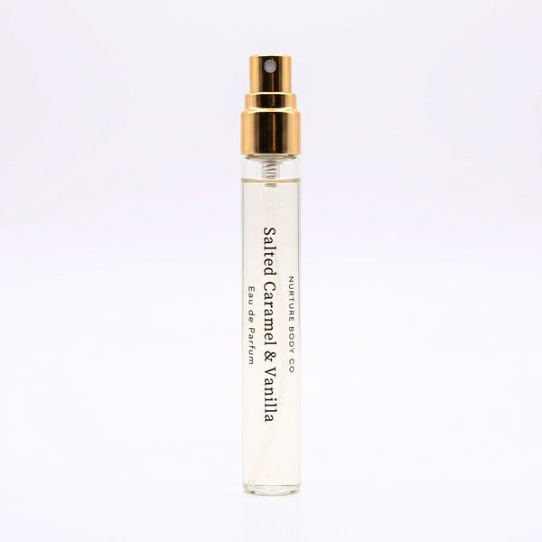 Small perfume bottle labeled 'Salted Caramel & Vanilla' on a light purple background