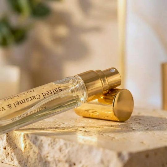 Salted Caramel atomizer on a marble surface with a blurred background