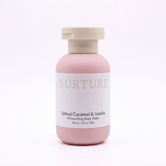 A bottle of Salted Caramel body wash on a white background.