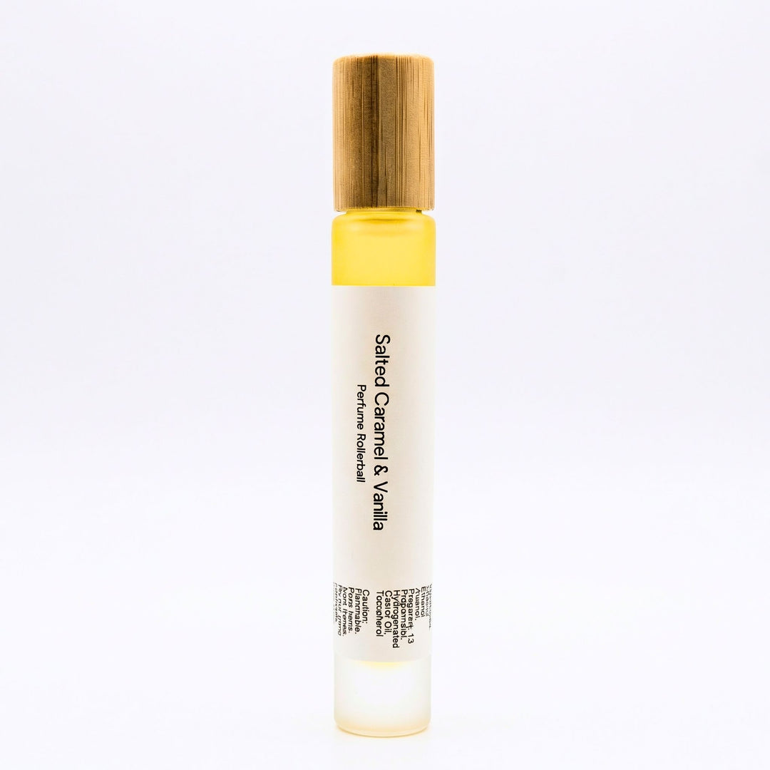 Salted Caramel & Vanilla perfume rollerball on a white background.