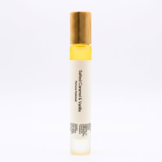 Salted Caramel &amp; Vanilla perfume rollerball on a white background.