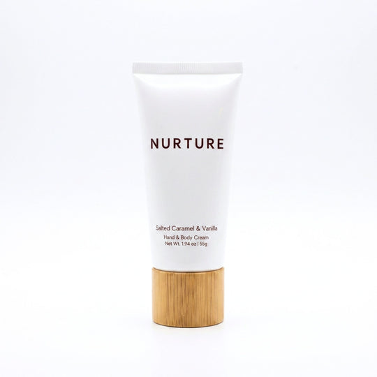 Hand and body cream with a wooden base on a white background