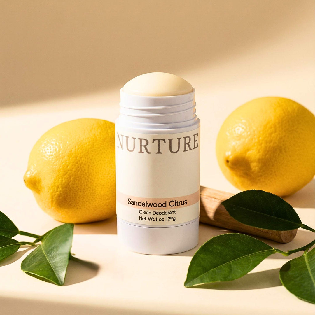 Sandalwood Citrus deodorant with lemons and leaves on a light background