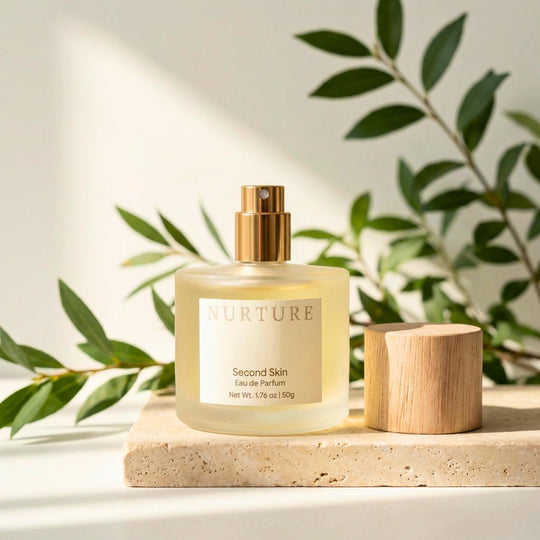 Bottle of Second Skin perfume on a stone slab.