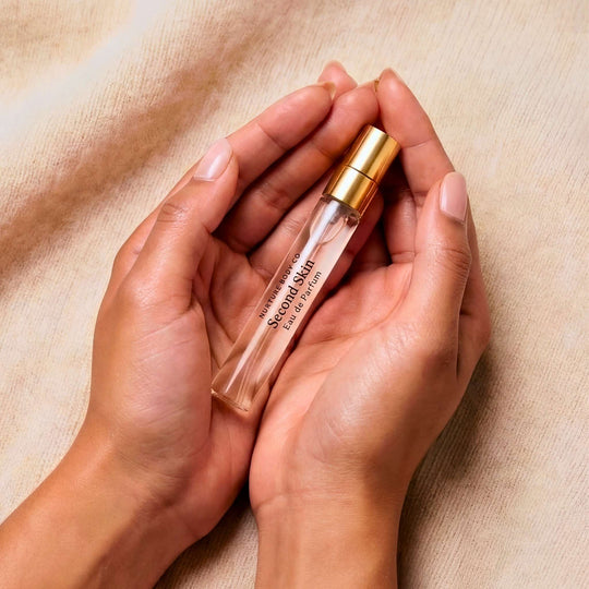 Second SKin atomizer bottle lying in a woman&