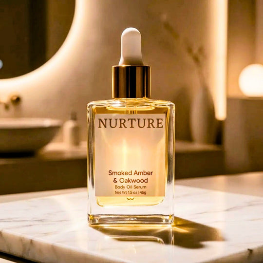 Smoked Amber body oil serum on a marble surface.