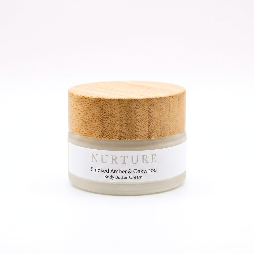 Jar of Smoked Amber Body Butter Cream on a white background.