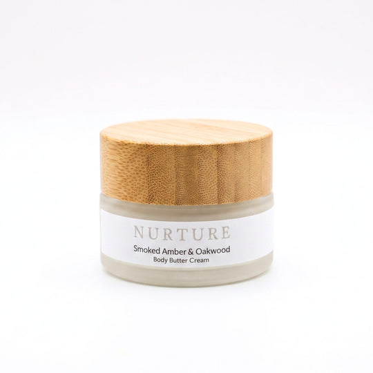 Jar of Smoked Amber Body Butter Cream on a white background.