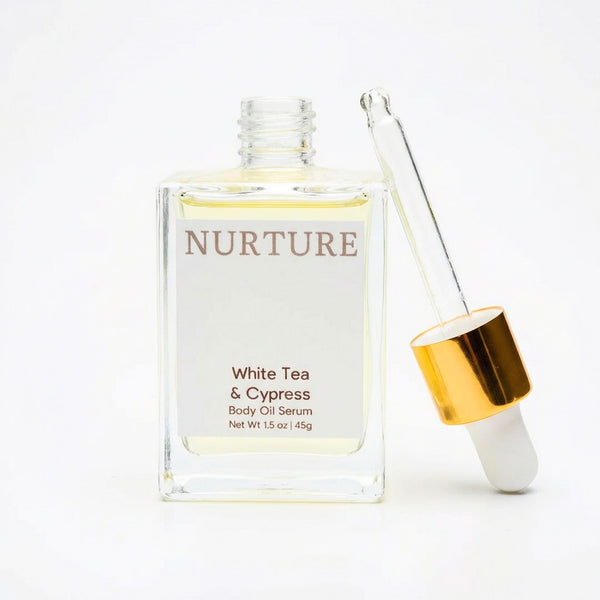 White Tea Cypress Body oil serum bottle labeled with dropper on a white background