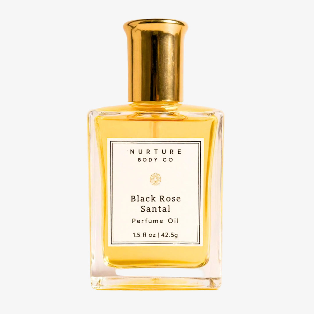 bottle of perfume oil against a white background.