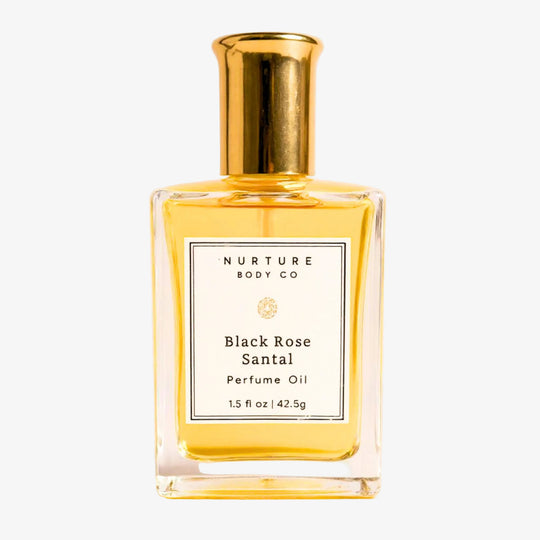 bottle of perfume oil against a white background.